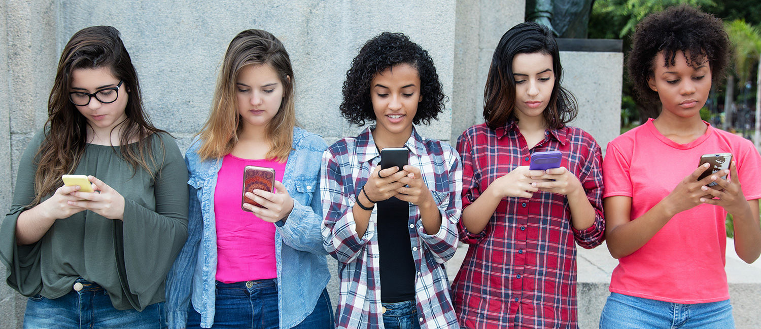  Girls using cell phones. 