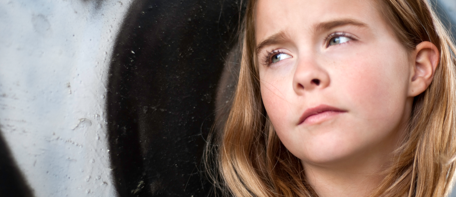 Troubled girl posing as if she's been subject of catcalling. 