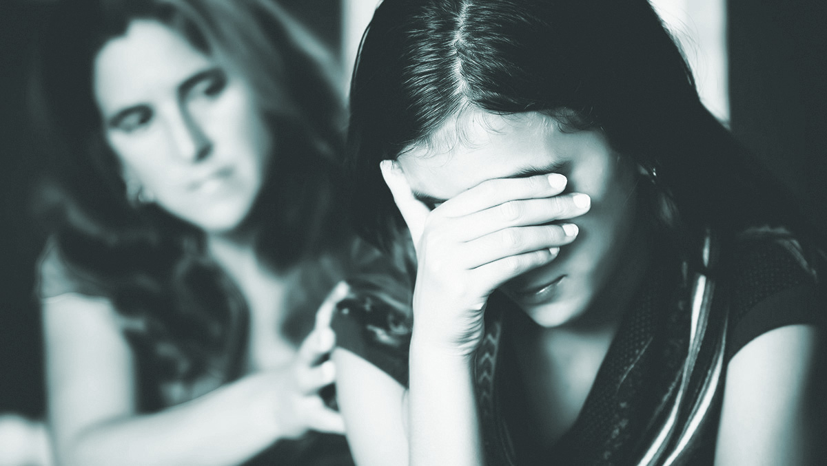 High school girl and her mom talking about teen sexual assault. 