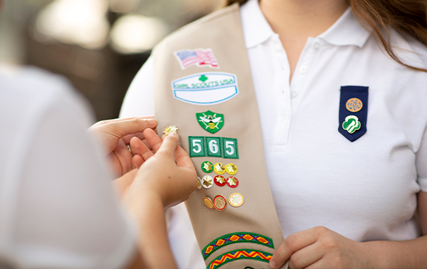 Senior Girl Scout being pinned with her Gold Award